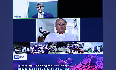 Thomas Hünig (Mitte), ehemaliger Leiter des Lehrstuhls für Immunbiologie, war online zugeschaltet. Oben im Bild Lars Dölken. 